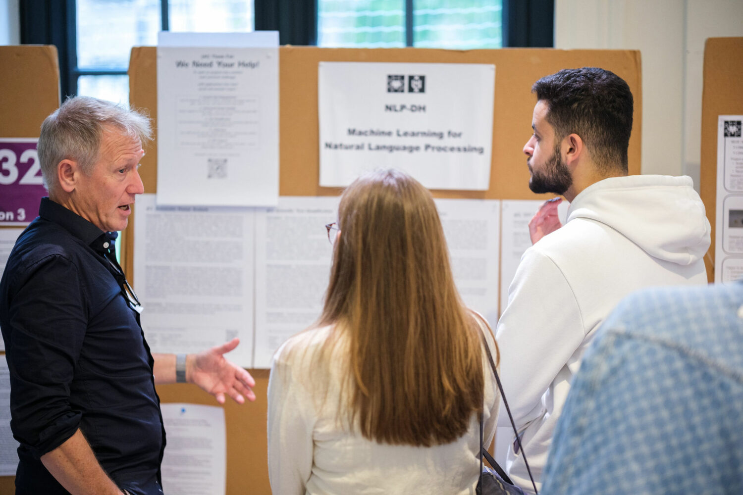 Our lab director Jaap Kamps at the ILLC stand 2 stairs down